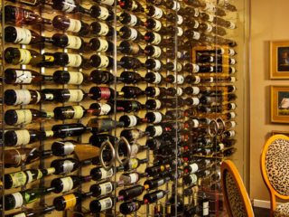 Contemporary glass wine cellar wall, custom design & install by Innovative Wine Cellar Designs.