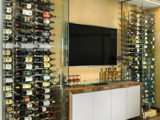 Contemporary glass dual temp wine cellar, custom design & install by Innovative Wine Cellar Designs.