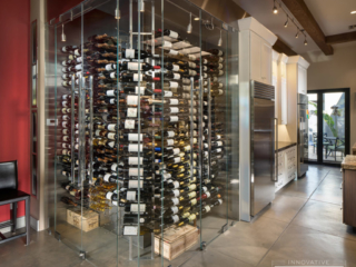 Contemporary corner kitchen glass wine cellar, custom design & install by Innovative Wine Cellar Designs.