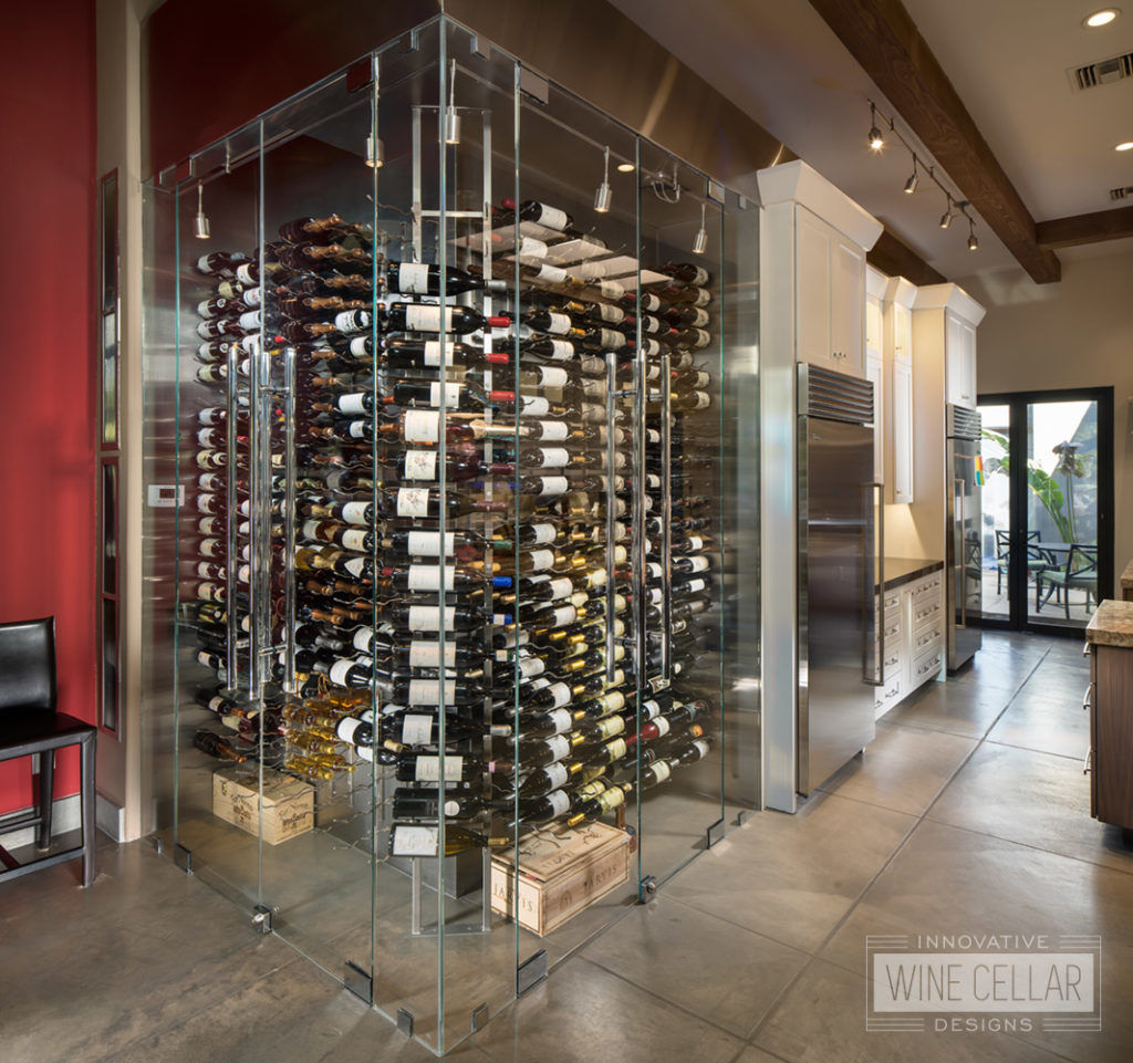 Contemporary corner kitchen glass wine cellar, custom design & install by Innovative Wine Cellar Designs.
