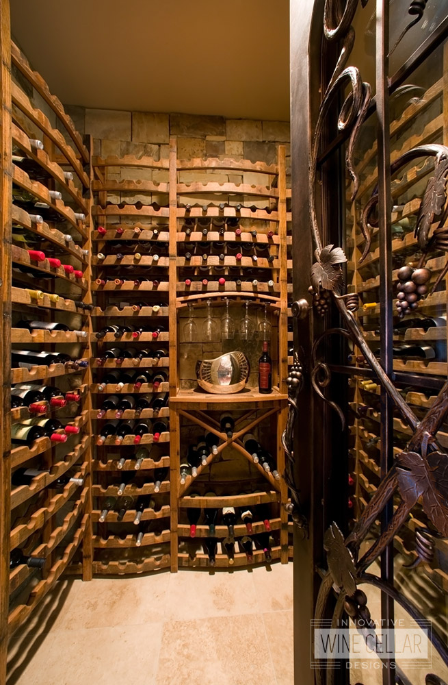 Custom reclaimed wine barrel wine racking for wine storage room.