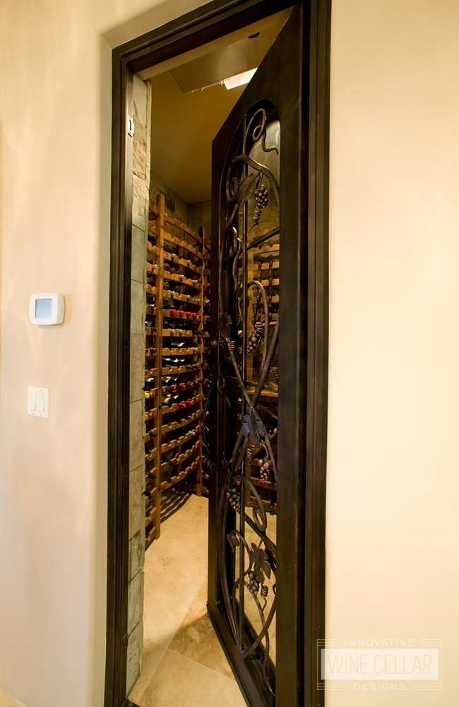 Custom Wrought Iron Wine Cellar Door with Iron Grape Vine Accents - By Innovative Wine Cellar Designs