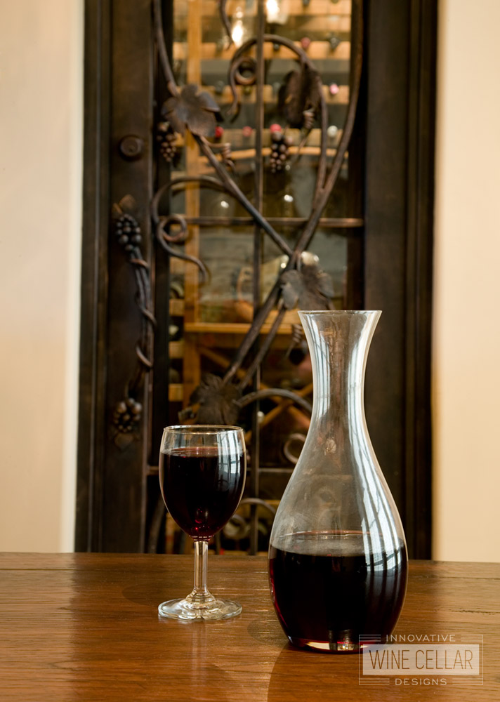 Custom Wrought Iron Wine Cellar Door with Iron Grape Vine Accents - By Innovative Wine Cellar Designs
