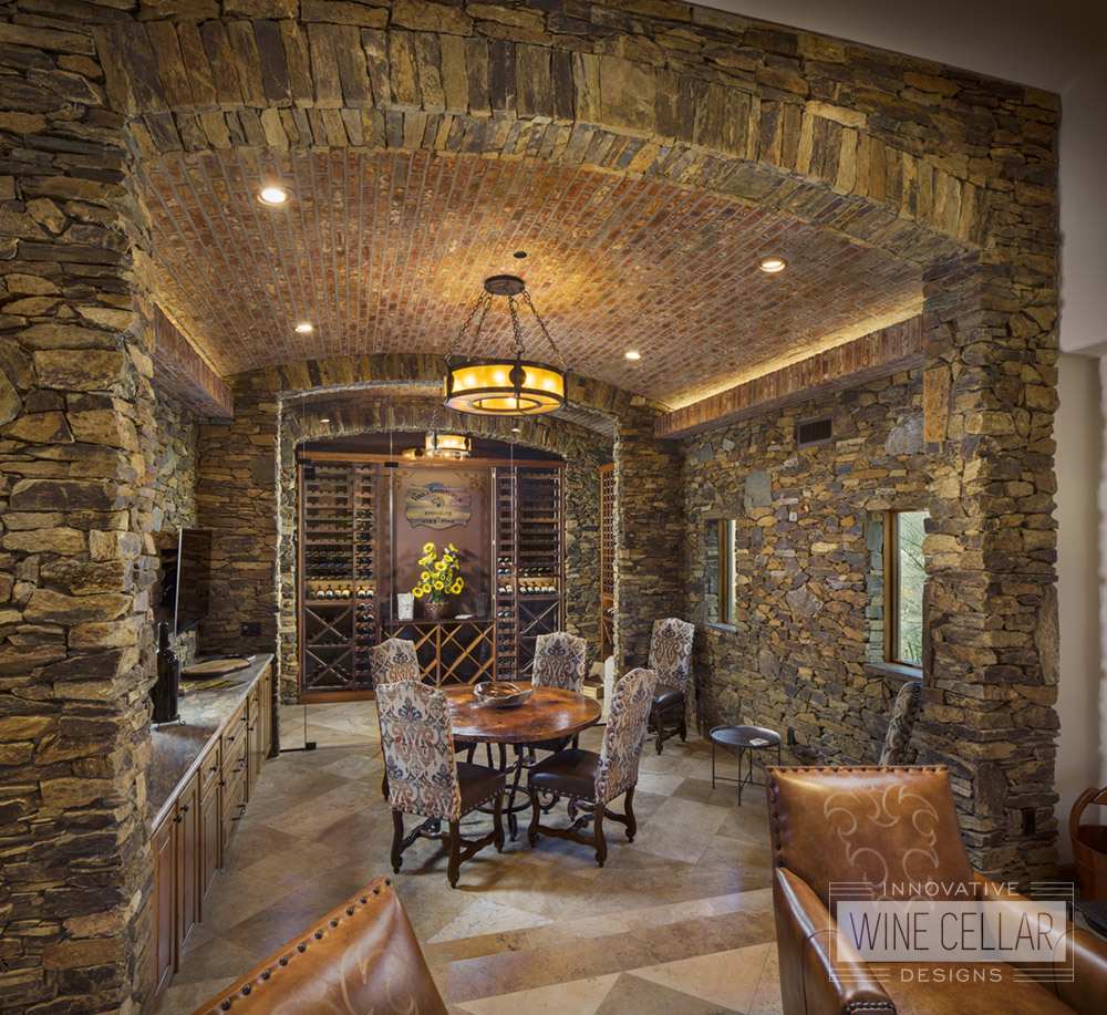 Traditional stone & brick wine cellar, custom design & install by Innovative Wine Cellar Designs.