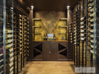 Wine cellar room with metal wine racks and dim lighting to match contemporary decor.