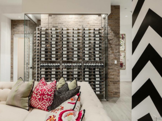 Contemporary glass enclosed wine cellar, custom design & install by Innovative Wine Cellar Designs.