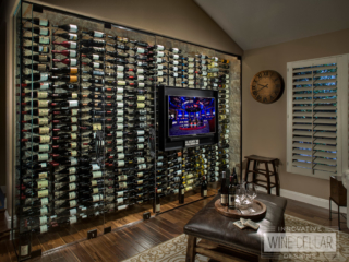 Recessed wine wall with glass doors in contemporary style living area.