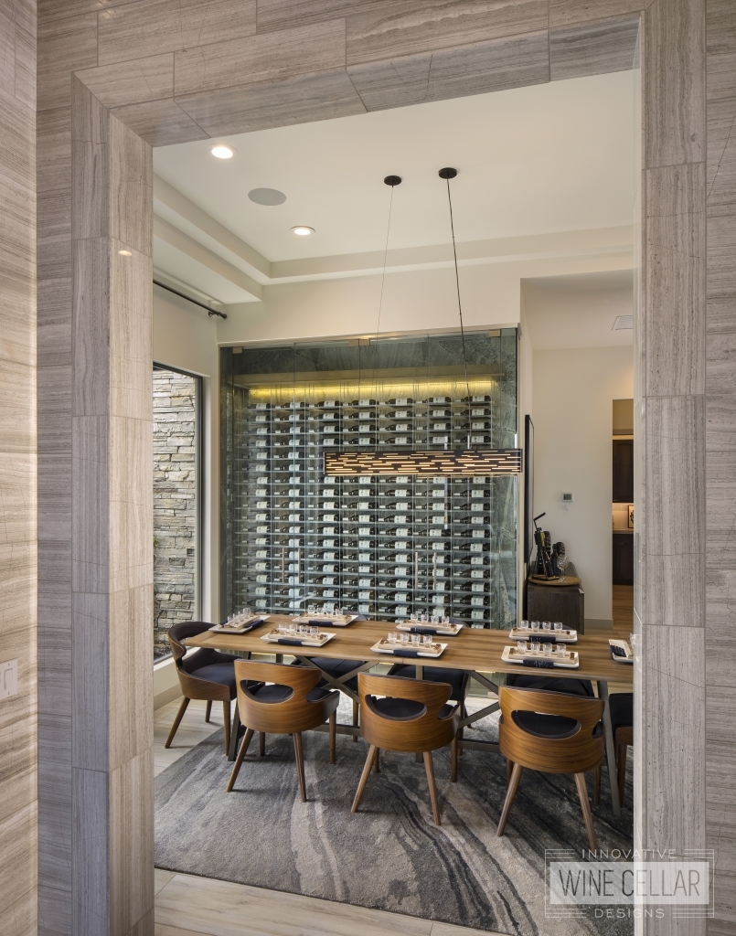 modern dining room with glass wine wall