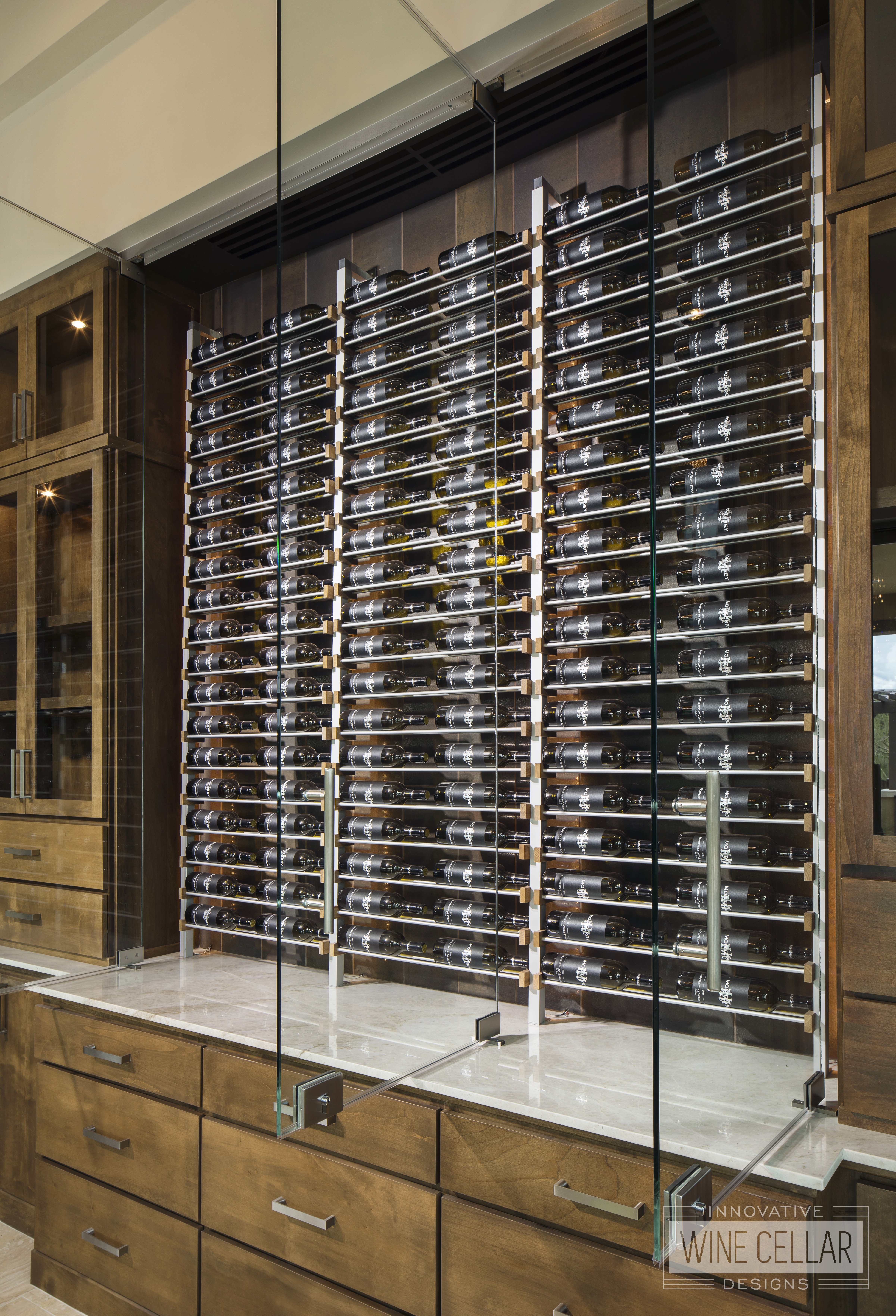 wine wall cabinets with open glass doors displaying wine at Verde River