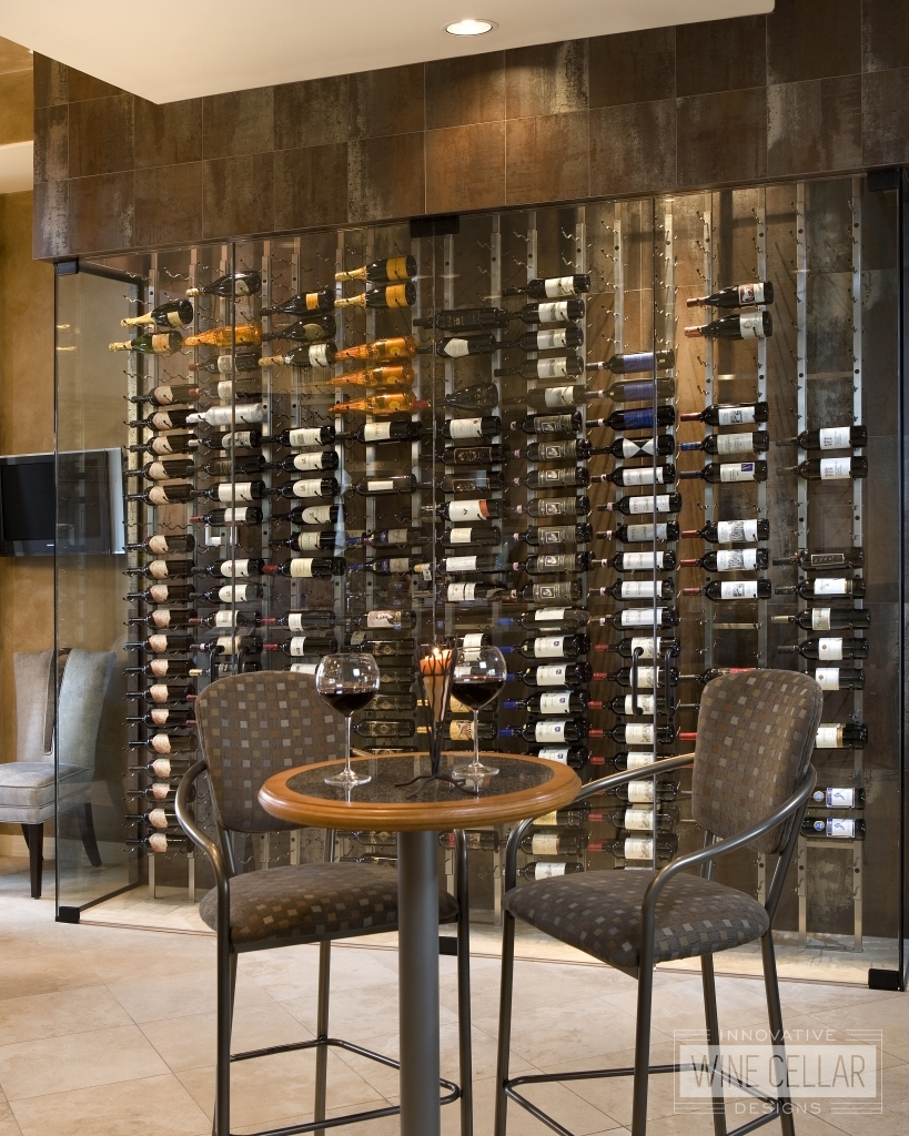 Modern glass wine wall with steel floor to ceiling wine racks